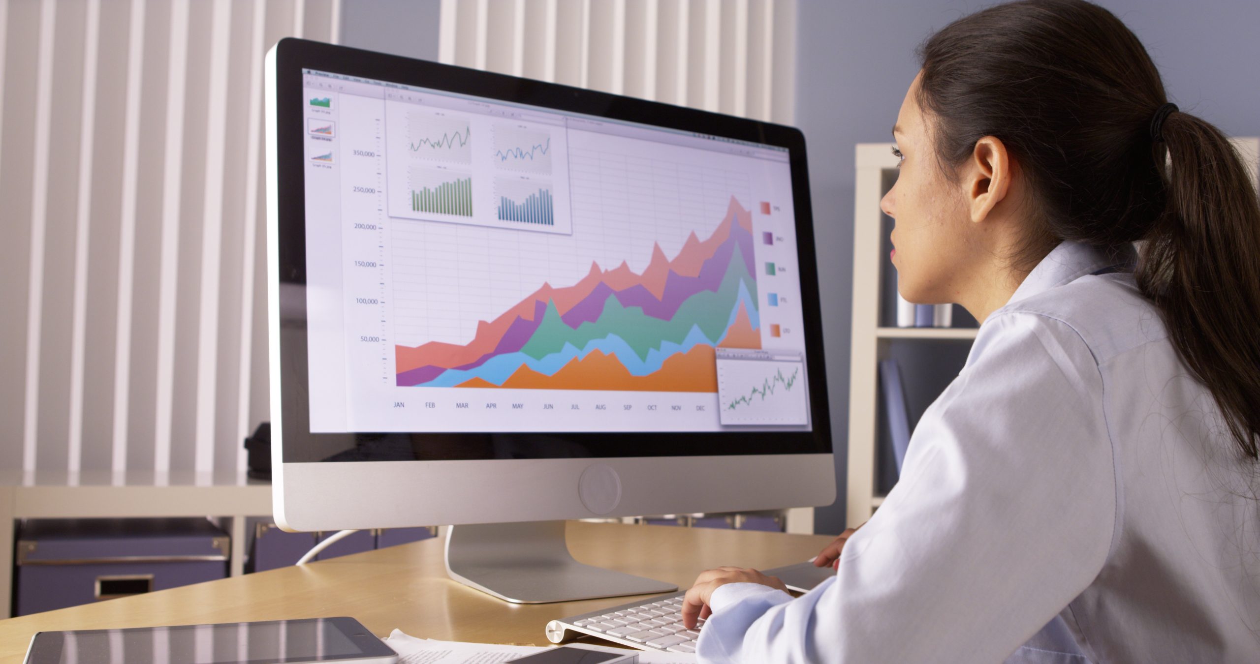 woman working on payroll in computer